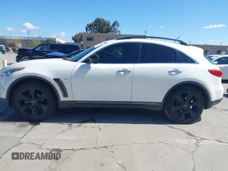 2015 Infiniti QX70 with VIN JN8CS1MU5FM380792, listed as a IAAI auction lot 41946084 with 128,928 mi miles and . Bid and sale history available at DreamBid. Image 14.