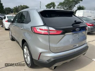 2020 Ford Edge Titanium z VIN 2FMPK3K95LBA30633, wystawiony jako IAAI lot #42473515 z przebiegiem 104 190 mil mil oraz . Historia ofert i sprzedaży dostępna na DreamBid. Obrazek 10.
