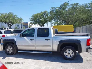 2013 Chevrolet Silverado 1500 LT with VIN 3GCPKSE71DG203443, listed as a IAAI auction lot 42033447 with 128,904 mi miles. Bid and sale history available at carsss.com. Image 14.
