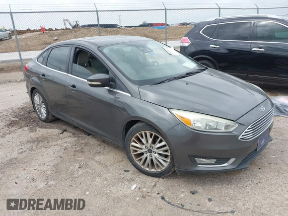 2016 Ford Focus Titanium z VIN 1FADP3J21GL260145, wystawiony jako IAAI lot #42137319 z przebiegiem 131 835 mil mil oraz . Historia ofert i sprzedaży dostępna na DreamBid. Obrazek 1.
