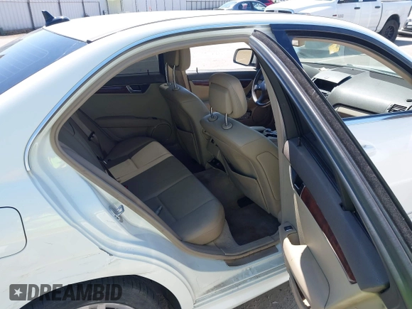 2009 Mercedes-Benz C-Class 3.0L Sport with VIN WDDGF54X09F233877, listed as a IAAI auction lot 42121123 with 215,698 mi miles. Bid and sale history available at carsss.com. Image 8.