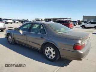 2003 Cadillac Seville Luxury SLS z VIN 1G6KS54Y93U279660, wystawiony jako Copart lot #75961404 z przebiegiem 107 591 mil mil oraz Szkoda całkowita • Salvage title. Historia ofert i sprzedaży dostępna na DreamBid. Obrazek 2.