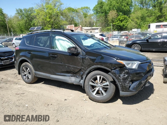2018 Toyota RAV4 XLE with VIN 2T3WFREVXJW471443, listed as a Copart auction lot 54890655 with 131,677 mi miles and Salvage title. Bid and sale history available at DreamBid. Image 4.