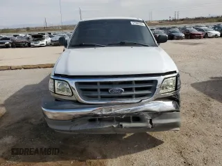 2003 Ford F-150 XL z VIN 1FTRX17233NB92067, wystawiony jako Copart lot #57986555 z przebiegiem 179 101 mil mil oraz Szkoda całkowita • Salvage title. Historia ofert i sprzedaży dostępna na DreamBid. Obrazek 5.