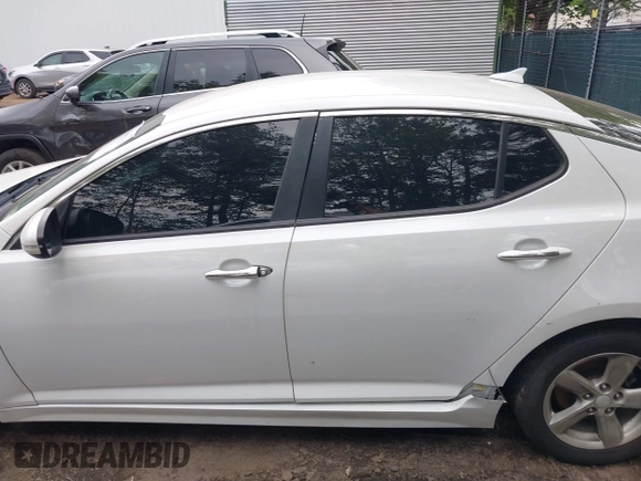 2015 Kia Optima LX with VIN KNAGM4A7XF5599309, listed as a IAAI auction lot 42493215 with 143,703 mi miles and . Bid and sale history available at DreamBid. Image 14.