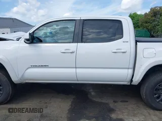 2021 Toyota Tacoma SR z VIN 5TFCZ5AN5MX265181, wystawiony jako IAAI lot #42077902 z przebiegiem 102 192 mil mil oraz . Historia ofert i sprzedaży dostępna na DreamBid. Obrazek 14.