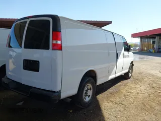2020 Chevrolet Express Cargo Van with VIN 1GCWGBFP8L1120262, listed as a IAAI auction lot 42010679 with 114,589 mi miles. Bid and sale history available at carsss.com. Image 4.