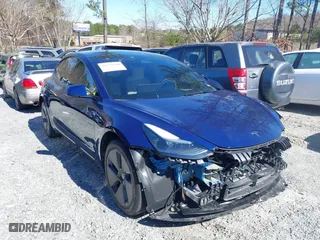 2023 Tesla Model 3 with VIN 5YJ3E1EA8PF671465, listed as a IAAI auction lot 41599200 with 21,859 mi miles. Bid and sale history available at carsss.com. Image 1.