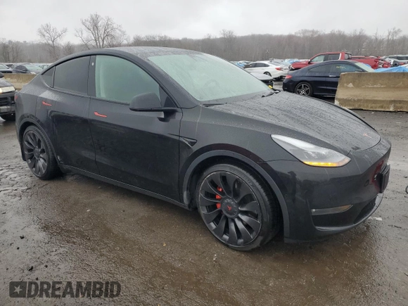 2022 Tesla Model Y Performance z VIN 7SAYGDEF9NF382883, wystawiony jako Copart lot #52028085 z przebiegiem 49 108 mil mil oraz Szkoda całkowita • Salvage title. Historia ofert i sprzedaży dostępna na DreamBid. Obrazek 4.