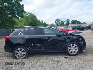 2015 Cadillac SRX Premium Collection z VIN 3GYFNGE36FS626641, wystawiony jako IAAI lot #42532380 z przebiegiem 178 799 mil mil oraz . Historia ofert i sprzedaży dostępna na DreamBid. Obrazek 13.