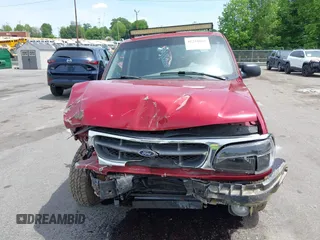 2000 Ford Explorer XLT z VIN 1FMZU73E7YZB60956, wystawiony jako IAAI lot #42218666 z przebiegiem 234 289 mil mil oraz . Historia ofert i sprzedaży dostępna na DreamBid. Obrazek 13.