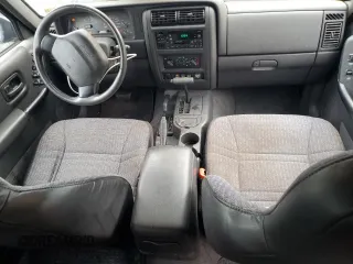 1999 Jeep Cherokee Sport with VIN 1J4FF68S8XL671341, listed as a Copart auction lot 58136475 with 139,848 mi miles and Salvage title. Bid and sale history available at DreamBid. Image 8.