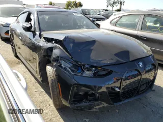 2022 BMW i4 M50 with VIN WBY33AW06NFM16543, listed as a Copart auction lot 52206564 with 11,514 mi miles. Bid and sale history available at carsss.com. Image 4.