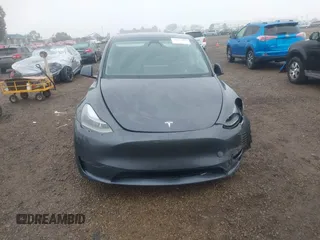 2023 Tesla Model Y Long Range with VIN 7SAYGDEE7PF894362, listed as a IAAI auction lot 41512492 with 27,513 mi miles. Bid and sale history available at carsss.com. Image 11.
