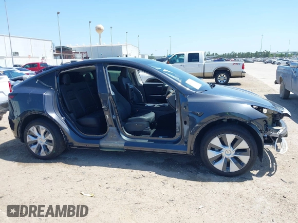 2024 Tesla Model Y with VIN 7SAYGDED2RF040745, listed as a IAAI auction lot 41986613 with 9,778 mi miles and . Bid and sale history available at DreamBid. Image 13.