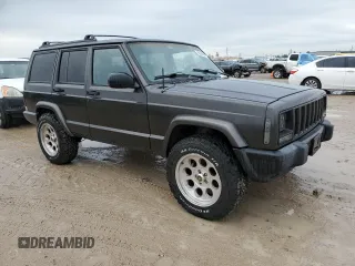 1999 Jeep Cherokee Sport with VIN 1J4FT68S2XL656679, listed as a Copart auction lot 88145875 with 254,038 mi miles and Salvage title. Bid and sale history available at DreamBid. Image 4.