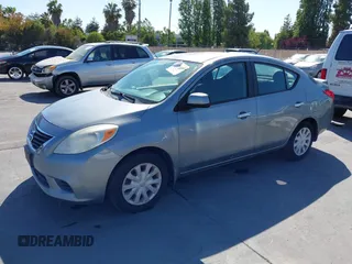 2013 Nissan Versa SV with VIN 3N1CN7AP5DL858384, listed as a IAAI auction lot 42543483 with 133,602 mi miles and . Bid and sale history available at DreamBid. Image 2.