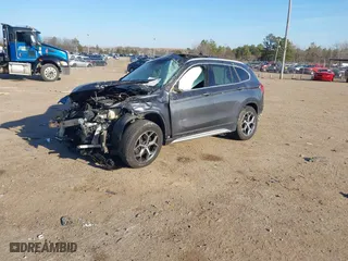 2018 BMW X1 xDrive28i with VIN WBXHT3C37J5K23855, listed as a IAAI auction lot 41442191 with 1 mi miles. Bid and sale history available at carsss.com. Image 2.