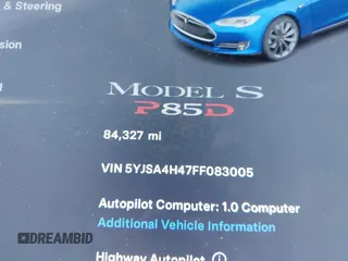 2015 Tesla Model S 85D with VIN 5YJSA4H47FF083005, listed as a IAAI auction lot 40970624 with 84,327 mi miles. Bid and sale history available at carsss.com. Image 7.