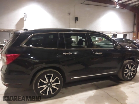 2020 Honda Pilot Touring 7-Passenger with VIN 5FNYF6H63LB032301, listed as a IAAI auction lot 38419333 with 50,433 mi miles and . Bid and sale history available at carsss.com. Image 14.