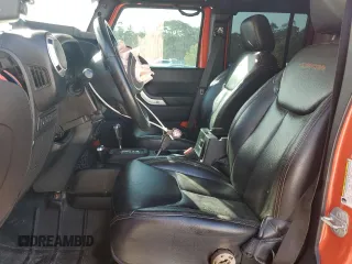 2015 Jeep Wrangler Unlimited Rubicon Hard Rock z VIN 1C4HJWFG7FL690098, wystawiony jako Copart lot #47431555 z przebiegiem 95 138 mil mil oraz Szkoda całkowita • Salvage title. Historia ofert i sprzedaży dostępna na DreamBid. Obrazek 7.