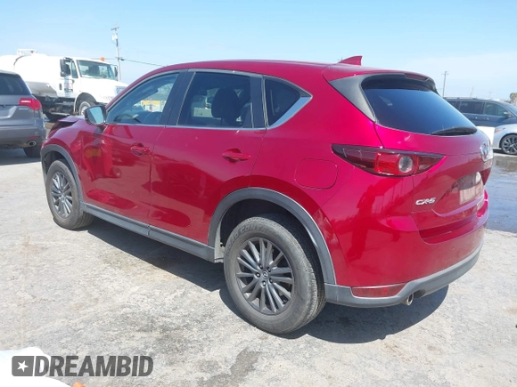 2019 Mazda CX-5 Touring with VIN JM3KFACM5K1516242, listed as a IAAI auction lot 42019803 with 113,953 mi miles. Bid and sale history available at carsss.com. Image 3.