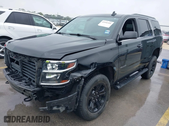 2020 Chevrolet Tahoe LS with VIN 1GNSCAKC5LR275173, listed as a IAAI auction lot 41931311 with 86,780 mi miles and . Bid and sale history available at DreamBid. Image 2.
