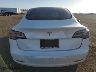 2021 Tesla Model 3 Standard Range Plus with VIN 5YJ3E1EA9MF100403, listed as a Copart auction lot 48561545 with 68,996 mi miles and Salvage Title. Bid and sale history available at carsss.com. Image 6.