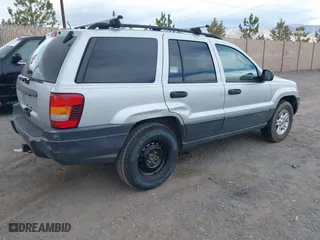 2004 Jeep Grand Cherokee Laredo with VIN 1J4GW48N14C434351, listed as a IAAI auction lot 41860077 with 152,404 mi miles. Bid and sale history available at carsss.com. Image 4.