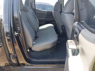 2018 Toyota Tacoma SR with VIN 5TFAX5GN5JX126118, listed as a IAAI auction lot 41949791 with 37,615 mi miles and . Bid and sale history available at DreamBid. Image 8.