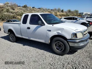 1998 Ford F-150 with VIN 1FTZX1720WKA20813, listed as a Copart auction lot 63852215 with 215,729 mi miles and Salvage title. Bid and sale history available at DreamBid. Image 4.