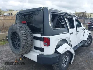 2016 Jeep Wrangler Unlimited Sahara with VIN 1C4BJWEG8GL129577, listed as a IAAI auction lot 42184373 with 185,761 mi miles and . Bid and sale history available at DreamBid. Image 4.