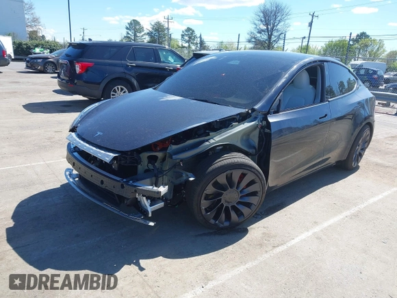 2024 Tesla Model Y Performance with VIN 7SAYGDEF1RA329825, listed as a IAAI auction lot 41762602 with 3,923 mi miles and . Bid and sale history available at DreamBid. Image 2.