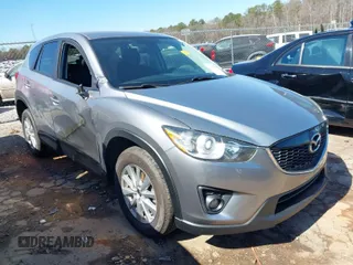 2015 Mazda CX-5 Touring with VIN JM3KE2CY0F0435575, listed as a IAAI auction lot 41652819 with 130,339 mi miles. Bid and sale history available at carsss.com. Image 1.