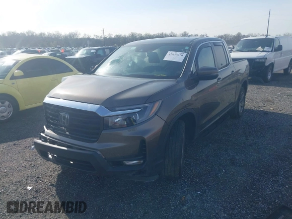 2022 Honda Ridgeline RTL z VIN 5FPYK3F51NB038239, wystawiony jako IAAI lot #41937070 z przebiegiem 39 012 mil mil oraz . Historia ofert i sprzedaży dostępna na DreamBid. Obrazek 2.
