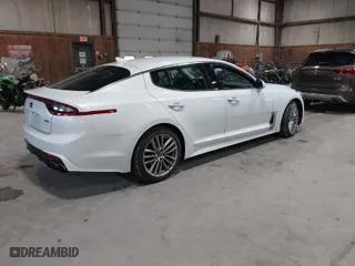 2018 Kia Stinger with VIN KNAE15LA6J6031821, listed as a IAAI auction lot 41871185 with 164,393 mi miles. Bid and sale history available at carsss.com. Image 4.