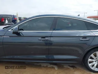2018 Audi A5 Sportback Premium z VIN WAUANCF5XJA022221, wystawiony jako IAAI lot #42041410 z przebiegiem 94 851 mil mil oraz . Historia ofert i sprzedaży dostępna na DreamBid. Obrazek 14.