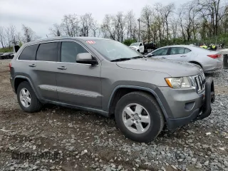 2011 Jeep Grand Cherokee Laredo with VIN 1J4RR4GG7BC578129, listed as a Copart auction lot 53147775 with 157,127 mi miles and Salvage title. Bid and sale history available at DreamBid. Image 4.