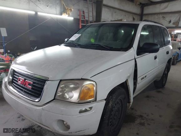 2004 GMC Envoy SLE with VIN 1GKDS13S642118163, listed as a IAAI auction lot 41809472 with 234,353 mi miles. Bid and sale history available at carsss.com. Image 2.