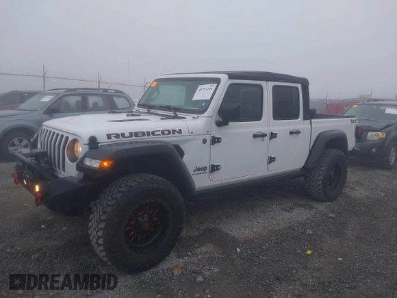 2022 Jeep Gladiator Rubicon z VIN 1C6JJTBG3NL111054, wystawiony jako IAAI lot #40793144 z przebiegiem 40 115 mil mil oraz . Historia ofert i sprzedaży dostępna na DreamBid. Obrazek 2.