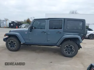 2015 Jeep Wrangler Unlimited Rubicon Hard Rock z VIN 1C4HJWFG1FL679873, wystawiony jako IAAI lot #41508722 z przebiegiem 97 165 mil mil oraz . Historia ofert i sprzedaży dostępna na DreamBid. Obrazek 14.