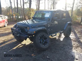 2018 Jeep Wrangler JK Unlimited Altitude with VIN 1C4BJWEG1JL842456, listed as a IAAI auction lot 41123988 with 55,310 mi miles. Bid and sale history available at carsss.com. Image 2.