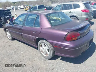 1998 Pontiac Grand Am SE with VIN 1G2NE52M1WC783104, listed as a IAAI auction lot 41911849 with 234,503 mi miles. Bid and sale history available at carsss.com. Image 3.