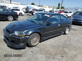 1997 Honda Civic DX with VIN 1HGEJ6128VL083271, listed as a Copart auction lot 72088024 with 329,655 mi miles and Salvage Title. Bid and sale history available at carsss.com. Image 1.