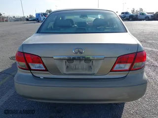 2002 Infiniti I35 Luxury with VIN JNKDA31A52T027346, listed as a IAAI auction lot 41709863 with 227,266 mi miles. Bid and sale history available at carsss.com. Image 16.