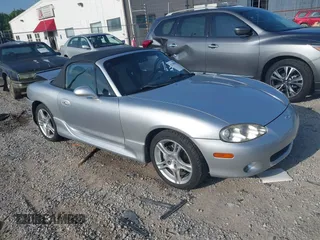 2005 Mazda MX-5 Miata LS with VIN JM1NB353950412638, listed as a IAAI auction lot 42740850 with 137,707 mi miles and . Bid and sale history available at DreamBid. Image 1.