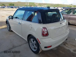 2011 MINI Hardtop with VIN WMWSU3C5XBT095591, listed as a IAAI auction lot 42366393 with 99,092 mi miles and . Bid and sale history available at DreamBid. Image 3.