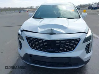 2020 Cadillac XT4 AWD Premium Luxury z VIN 1GYFZDR44LF036461, wystawiony jako IAAI lot #41934371 z przebiegiem 90 545 mil mil oraz . Historia ofert i sprzedaży dostępna na DreamBid. Obrazek 6.