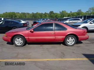 1996 Ford Thunderbird LX with VIN 1FALP62W0TH142986, listed as a IAAI auction lot 42030900 with 168,993 mi miles. Bid and sale history available at carsss.com. Image 14.
