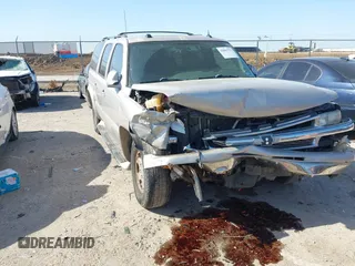 2005 Chevrolet Suburban LT z VIN 1GNEC16Z15J151950, wystawiony jako IAAI lot #42001731 z przebiegiem 304 480 mil mil oraz . Historia ofert i sprzedaży dostępna na DreamBid. Obrazek 1.